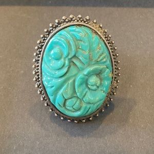Turquoise color ring with carved flowers